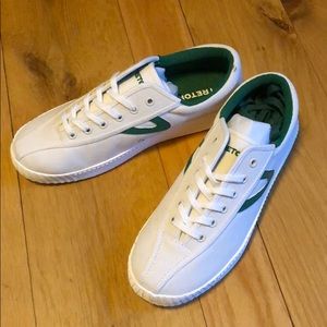 Green and white Tretorn sneakers